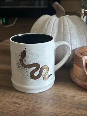 Gold snake mug with black interior